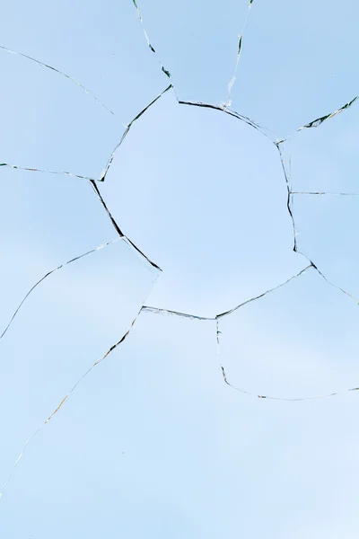 Buraco rachaduras vidro quebrado — Fotografia de Stock