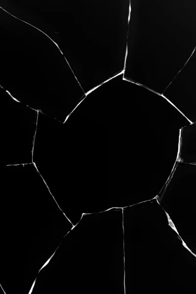 Hole glass broken cracks black — Stock Photo, Image