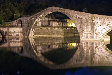 Devils Bridge at Night in Lucca, Italy clipart