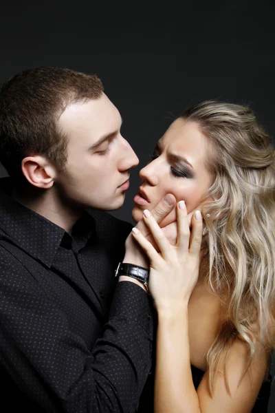 Handsome man is about to kiss a beautiful woman — Stock Photo, Image