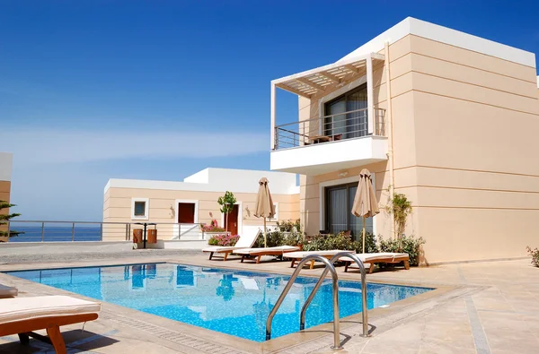 Swimming pool at the modern luxury villa, Crete, Greece Royalty Free Stock Images