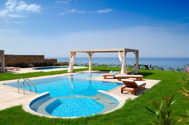 Swimming pool at luxury villa, Crete, Greece clipart