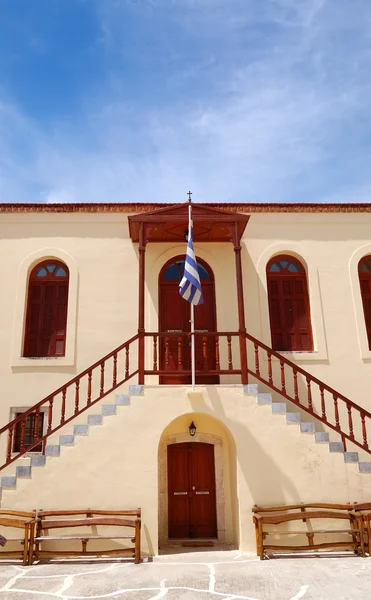 Old Greek religious building and flag, Crete, Greece — Stock Photo, Image