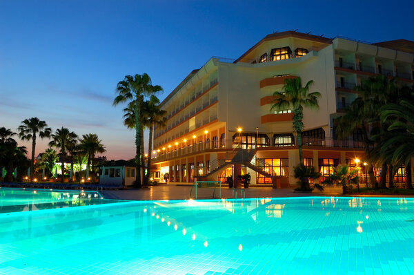Night illumination during sunset at popular hotel, Antalya, Turk