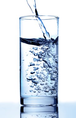 Pure water is poured in a glass clipart