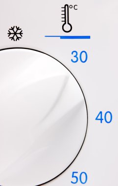 Temperature button on a washing machine clipart