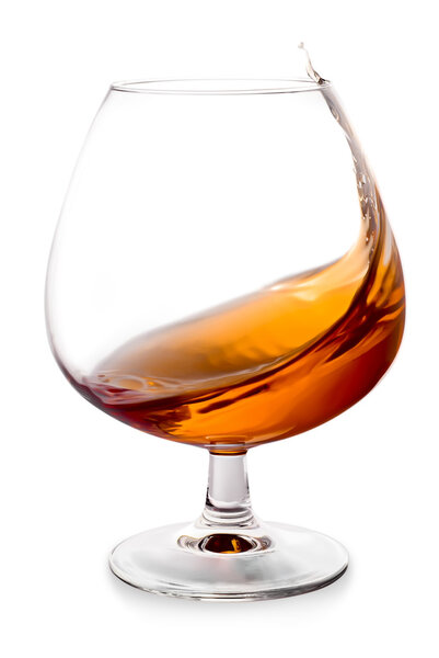 The glass with splashes brandy