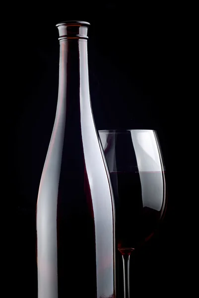 Винное стекло и бутылка — стоковое фото