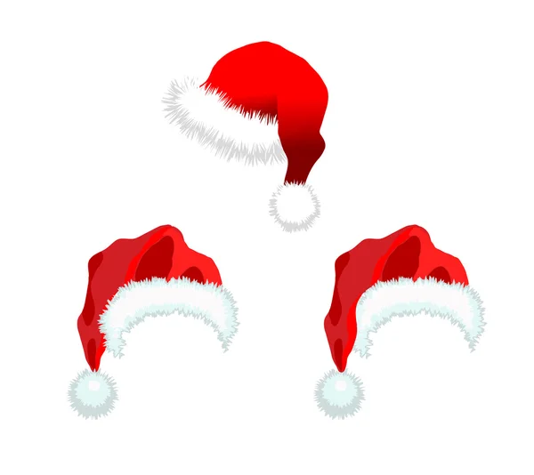 Три красных шапки Санта-Клауса — стоковое фото