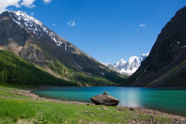 Mountain lake in background with high mountain clipart