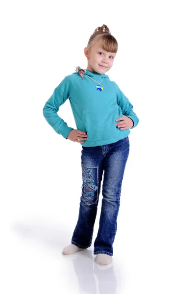 Charming little girl standing in a model pose. Isolated on the w — Stock Photo, Image