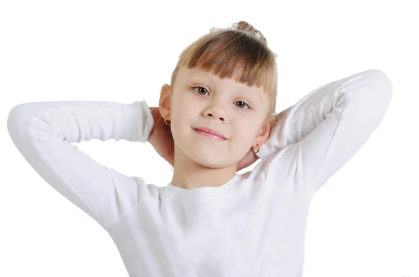 Charming little girl standing in a model pose. Isolated on the w — Stock Photo, Image