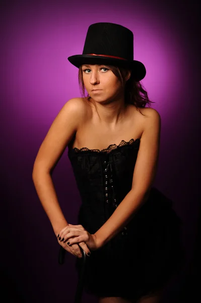 Beauty woman in black corset and silk hat — Stock Photo, Image