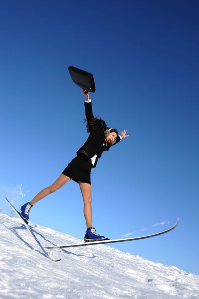 Happy Jumping Businesswoman Skiing — Stock Photo, Image