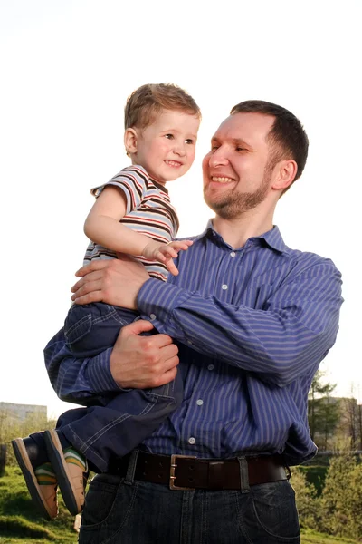 stock image Father and son together walking in the park