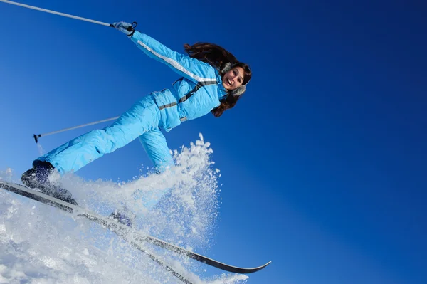 Jump of glad young skier — Stock Photo, Image