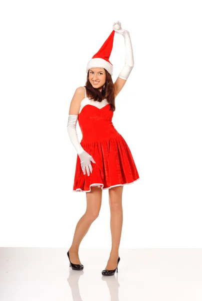 Женщина позирует в красном рождественском платье — стоковое фото