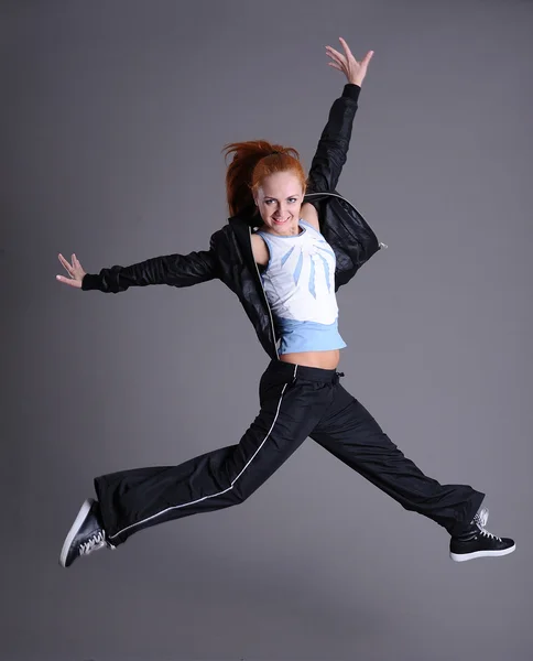 Woman jumping and dancing — Zdjęcie stockowe