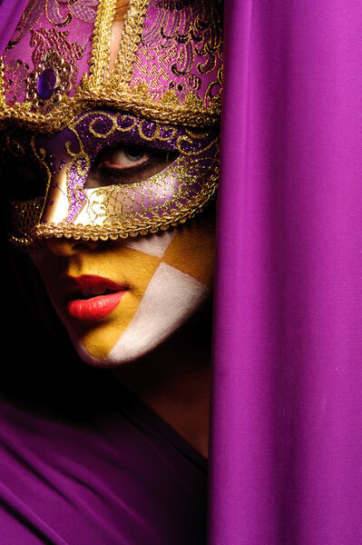 Close up portrait of woman in violet mask