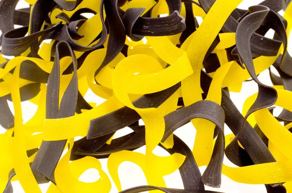 Black and yellow pasta — Stock Photo, Image