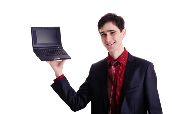 Podnikatel drží černou netbook — Stock fotografie