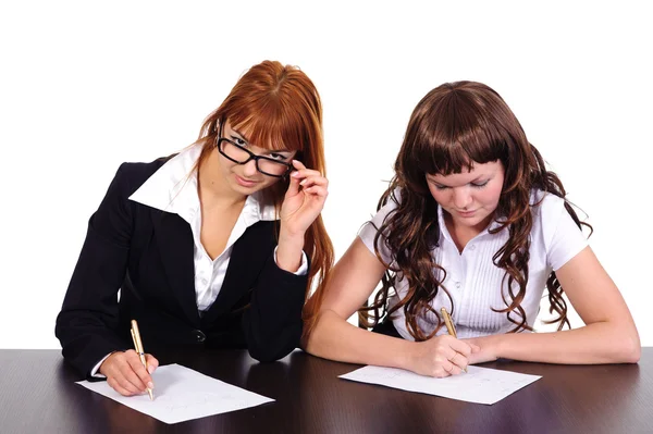 Two business women working together Royalty Free Stock Photos