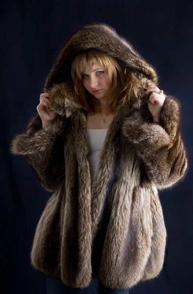 Girl in a fur coat — Stock Photo, Image
