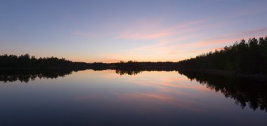 Lake panorama at sunset clipart