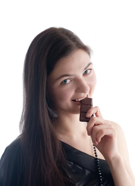 The girl eats chocolate — Stock Photo, Image