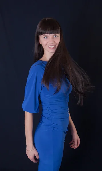 Pige i en blå kjole - Stock-foto