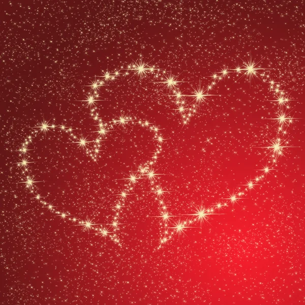 Hjärtat av guld stjärnor på en röd bakgrund — Stockfoto