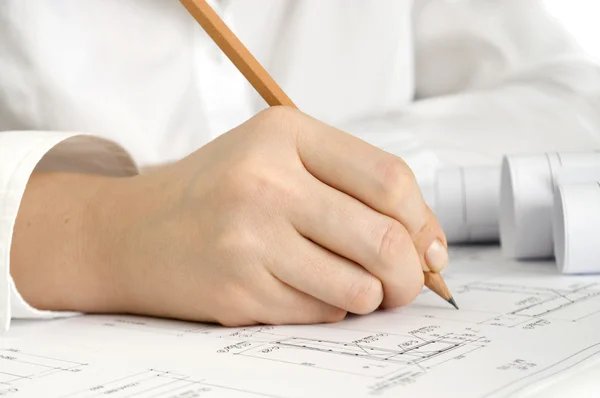 Hand with pencil drawing construction plan — Stock Photo, Image