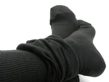 Feet in black, plump and long stockings clipart