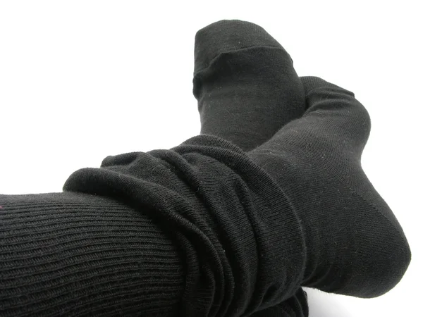 Feet in black, plump and long stockings — Stock Photo, Image
