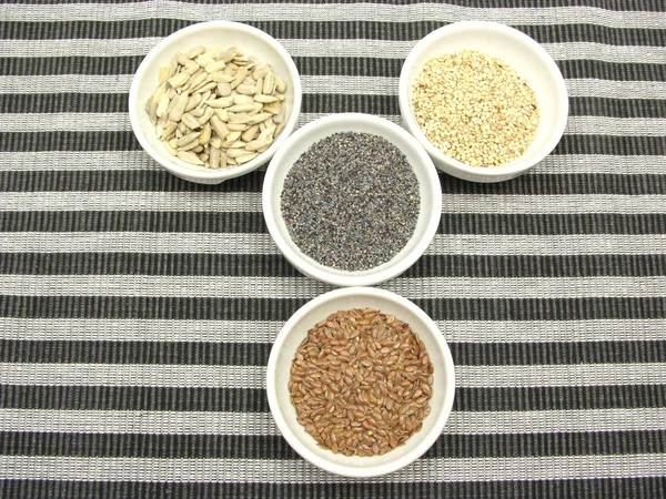 Four Bowl Different Seeds Striped Background — Stock Photo, Image