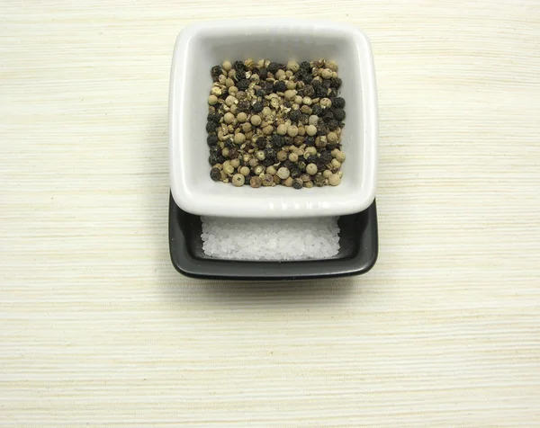 Bowls Chinaware Peppercorns Salt Beige Underlay — Stock Photo, Image