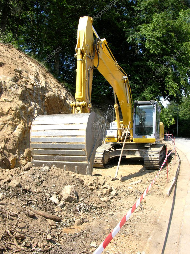 Yellow digger working on a site — Stock Photo © lantapix #5144459