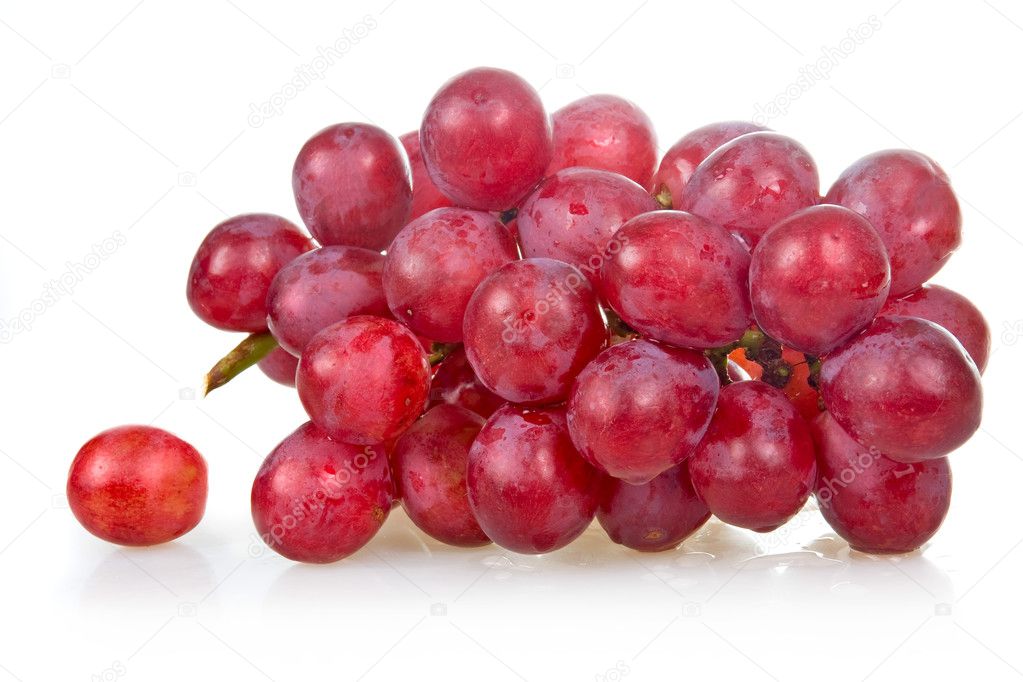 Bunch of ripe pink grapes isolated on white background