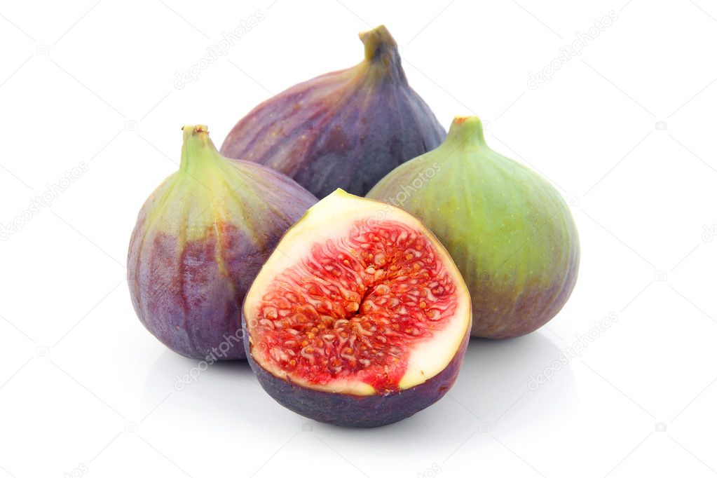 Ripe sliced purple and green fig fruit isolated