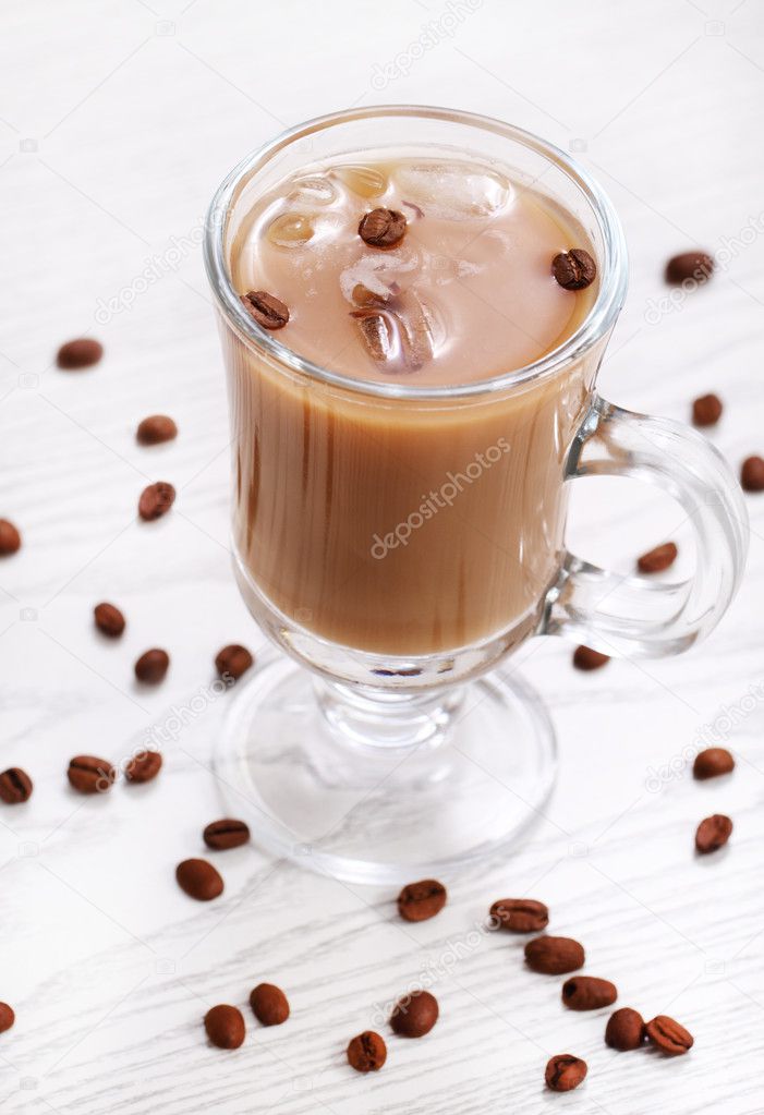 Ice coffee on the white wooden background