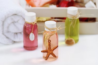 Spa setting with massage oil bottles clipart