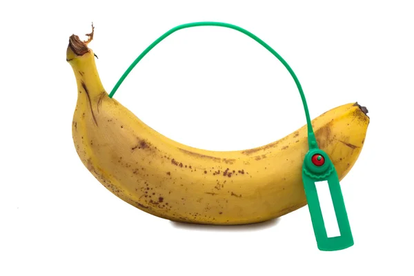 Banane Avec Une Étiquette Sur Fond Blanc — Photo