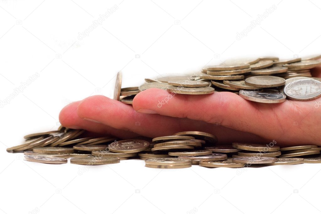 Hand filled up by coins on a white background