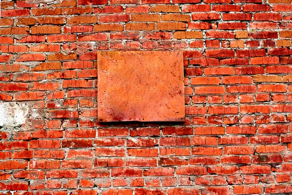 Brick wall with plate — Stock Photo, Image