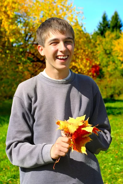 Teenager with leafs — Stock Photo, Image