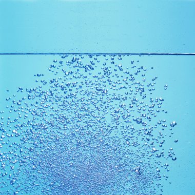 A lot of bubbles in the water through the glass clipart