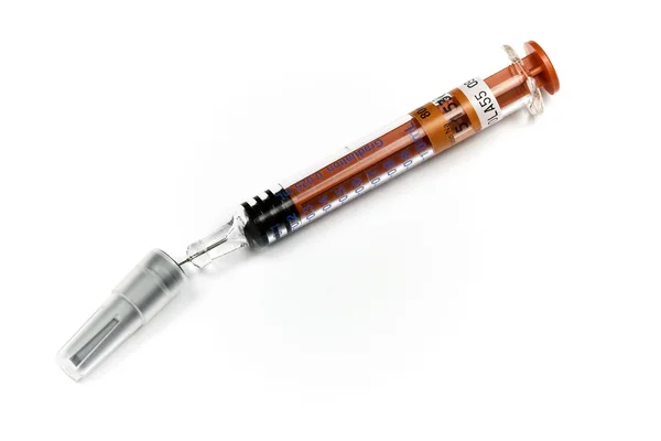 Syringe with protective needle cap — Stock Photo, Image