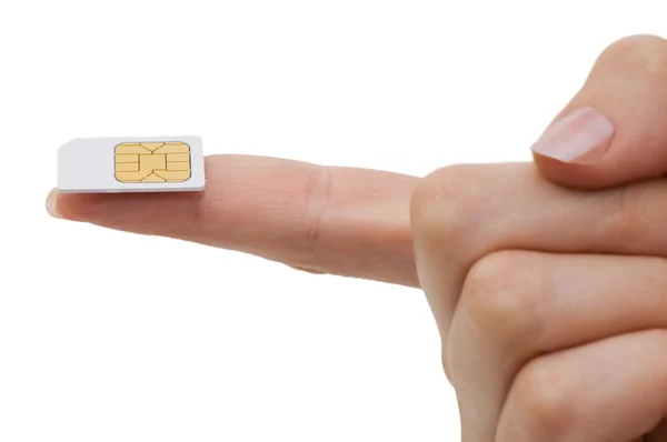 Κάρτα SIM σε ένα χέρι που απομονώνονται σε λευκό φόντο — Φωτογραφία Αρχείου