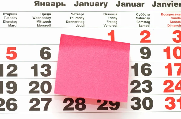 Close up van post-it note op kalender — Stockfoto