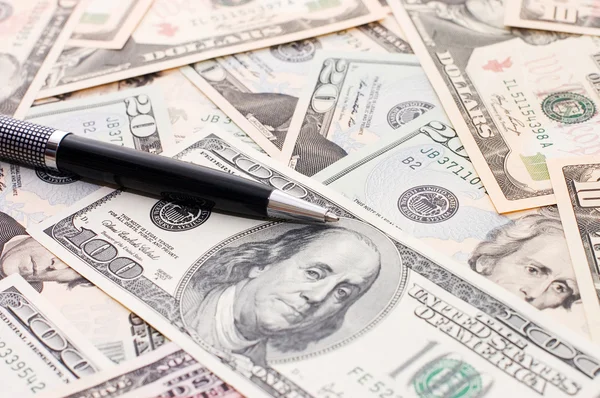 Dollar banknotes and pen — Stock Photo, Image